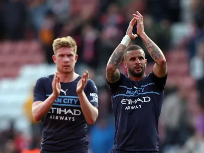 Soccer Football - FA Cup Quarter Final - Southampton v Manchester City - St Mary's Stadium, Southampton, Britain - March 20, 2022 Manchester City's Kevin De Bruyne and Kyle Walker applauds fans after the match REUTERS/Ian Walton