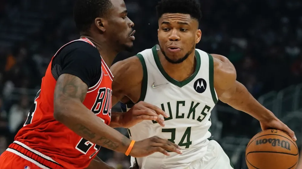 Milwaukee Bucks' Giannis Antetokounmpo drives past Chicago Bulls' Javonte Green during the first half of an NBA basketball game Tuesday, March 22, 2022, in Milwaukee. (AP Photo/Morry Gash)