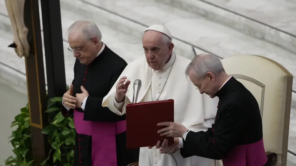 Pope Francis delivers his blessing during an audience with the members of the Italian Prosecutors High Council, in the Paul VI hall at the Vatican, Friday, April 8, 2022. (AP Photo/Alessandra Tarantino)