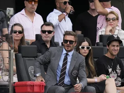 David Beckham, center, a co-owner and president of soccer operations for Inter Miami, watches an MLS soccer match against Los Angeles FC, Saturday, March 12, 2022, in Fort Lauderdale, Fla. (AP Photo/Rebecca Blackwell)