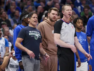 Apr 18, 2022; Dallas, Texas, USA; Dallas Mavericks injured guard Luka Doncic (77) and owner Mark Cuban speak to referee Ed Malloy (14) against the Utah Jazz during the second quarter in game two of the first round of the 2022 NBA playoffs at American Airlines Center. Mandatory Credit: Kevin Jairaj-USA TODAY Sports