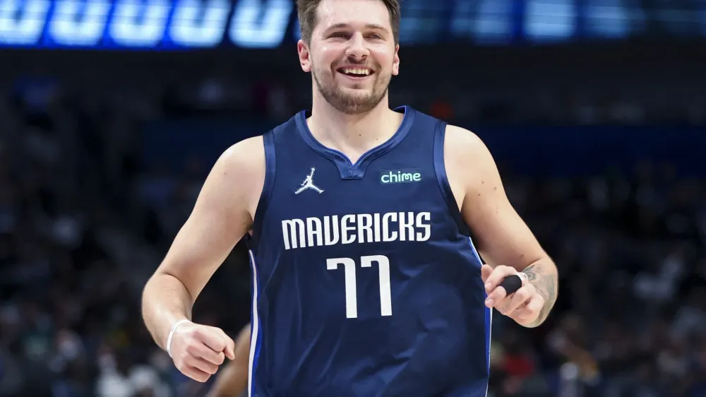 Jan 29, 2022; Dallas, Texas, USA; Dallas Mavericks guard Luka Doncic (77) laughs during the second half against the Indiana Pacers at American Airlines Center. Mandatory Credit: Kevin Jairaj-USA TODAY Sports