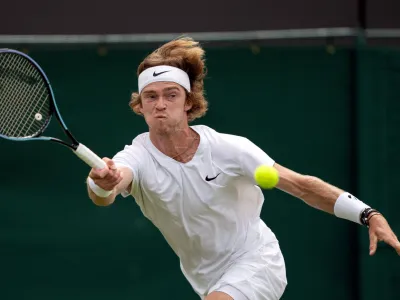 FILE PHOTO: Tennis - Wimbledon - All England Lawn Tennis and Croquet Club, London, Britain - July 5, 2021 Russia's Andrey Rublev in action during his fourth round match against Hungary's Marton Fucsovics Pool via REUTERS/Jed Leicester/File Photo
