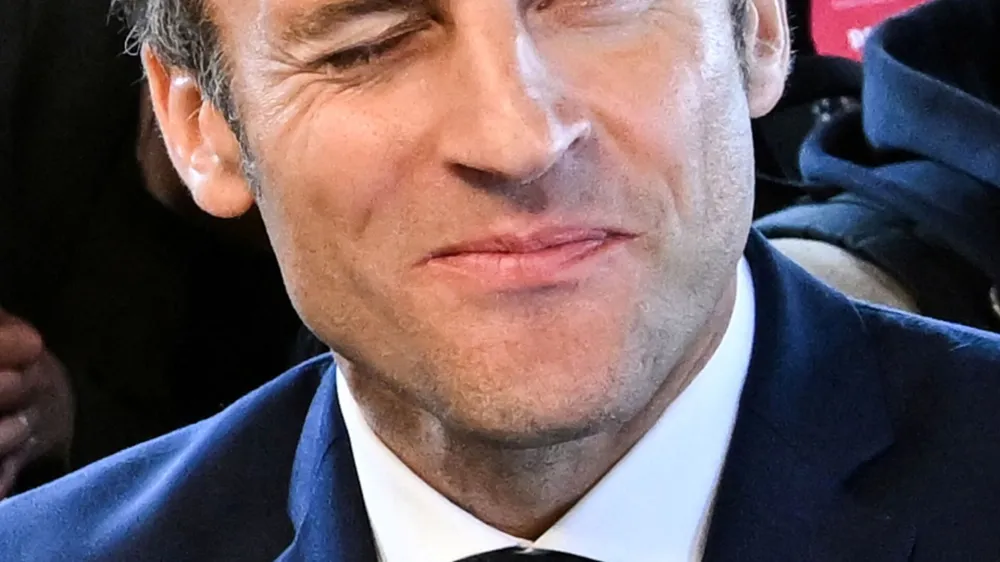 French President Emmanuel Macron gestures, during a visit to Barbazan-Debat, Hautes-Pyrenees, France, April 29, 2022. Caroline Blumberg/Pool via REUTERS