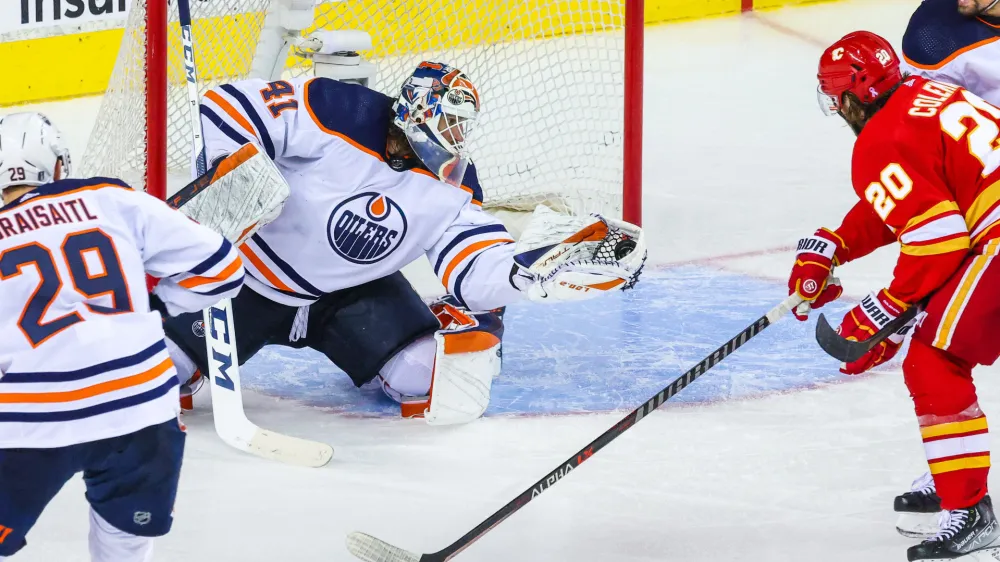 May 26, 2022; Calgary, Alberta, CAN; Edmonton Oilers goaltender Mike Smith (41) makes a save against the Calgary Flames during the third period in game five of the second round of the 2022 Stanley Cup Playoffs at Scotiabank Saddledome. Mandatory Credit: Sergei Belski-USA TODAY Sports