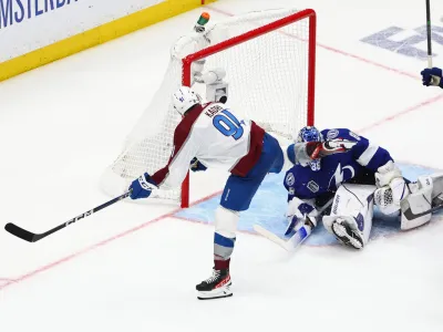 Jun 22, 2022; Tampa, Florida, USA; Colorado Avalanche center Nazem Kadri (91) scores the game winning goal against Tampa Bay Lightning goaltender Andrei Vasilevskiy (88) during overtime in game four of the 2022 Stanley Cup Final at Amalie Arena. Mandatory Credit: Mark J. Rebilas-USA TODAY Sports