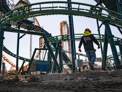 Construction is underway in the amusement park district of Coney Island, Friday, June 17, 2022, in the Brooklyn borough of New York. Luna Park in Coney Island will open three new major attractions this season alongside new recreational areas and pedestrian plazas. (AP Photo/John Minchillo)
