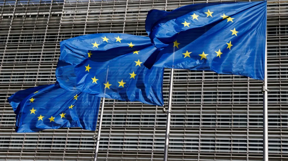 FILE PHOTO: European Union flags flutter outside the EU Commission headquarters in Brussels, Belgium June 17, 2022. REUTERS/Yves Herman/File Photo/File Photo
