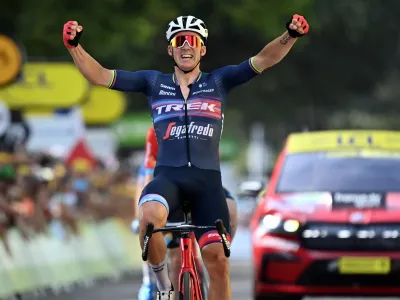 15 July 2022, France, Saint-Etienne: Danish cyclist Mads Pedersen of Trek-Segafredo celebrates winning the 13th stage of the 109th edition of the Tour de France cycling race, a 193-kilometer-long flat stage from Le Bourg-d'Oisans to Saint-Etienne. Photo: David Stockman/BELGA/dpa