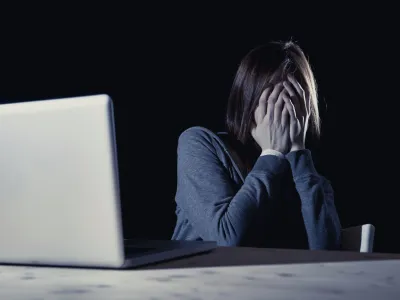 teenager girl suffering cyberbullying scared and depressed exposed to cyber bullying and internet harassment feeling sad and vulnerable in internet stalker danger and abuse problem