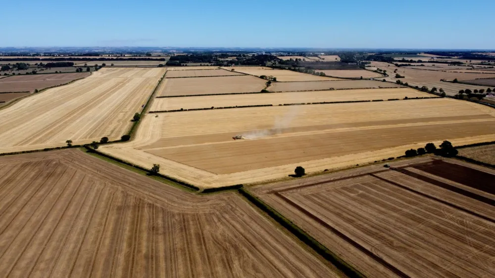 An aerial view of the harvest during the heatwave in Scampton, Lincolnshire, Britain, August 11, 2022. REUTERS/Carl Recine