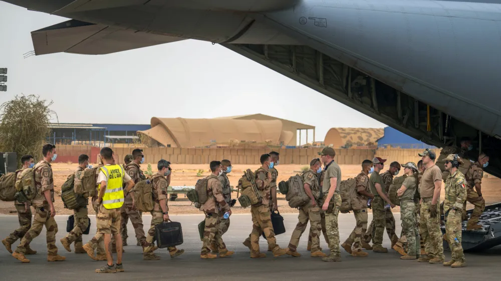 FILE - French Barkhane force soldiers who wrapped up a four-month tour of duty in the Sahel leave their base on a US Air Force C130 transport plane in Gao, Mali, June 9, 2021. French President Emmanuel Macron announced at a press conference Thursday Feb. 17, 2022 that he is withdrawing French troops from Mali. France intends to maintain its military operations to fight Islamic extremism in other countries in Africa's broader Sahel region. (AP Photo/Jerome Delay, File)