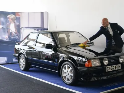 The Ford Escort RS Turbo Series 1, belonged to the late Diana, Princess of Wales, is seen during a preview of an auction at Silverstone circuit, in Northamptonshire, England, Friday, Aug. 26, 2022. The Ford Escort RS Turbo was driven by Diana, Princess of Wales from 1985 until 1988 and goes on auction for the first time, on the year that marks the 25th anniversary of her death, on Aug. 31, 1997. (AP Photo/Alberto Pezzali)