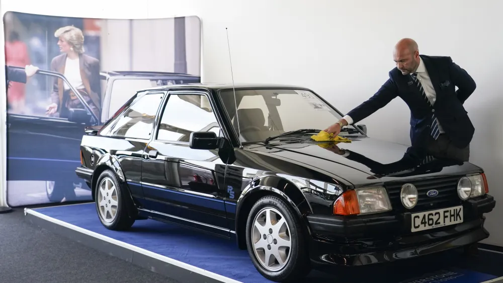 The Ford Escort RS Turbo Series 1, belonged to the late Diana, Princess of Wales, is seen during a preview of an auction at Silverstone circuit, in Northamptonshire, England, Friday, Aug. 26, 2022. The Ford Escort RS Turbo was driven by Diana, Princess of Wales from 1985 until 1988 and goes on auction for the first time, on the year that marks the 25th anniversary of her death, on Aug. 31, 1997. (AP Photo/Alberto Pezzali)