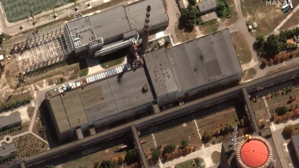 This satellite image provided by Maxar Technologies shows recent damage to the roof of a building adjacent to several of the nuclear reactors at the Zaporizhzhia nuclear plant in Russian occupied Ukraine, Monday Aug. 29, 2022. A team from the U.N. nuclear watchdog on Monday started its journey to the Zaporizhzhia atomic power plant at the heart of fighting in Ukraine, a long-awaited mission to inspect crucial safety systems that the world hopes will help avoid a catastrophe. (Satellite image &copy;2022 Maxar Technologies via AP)