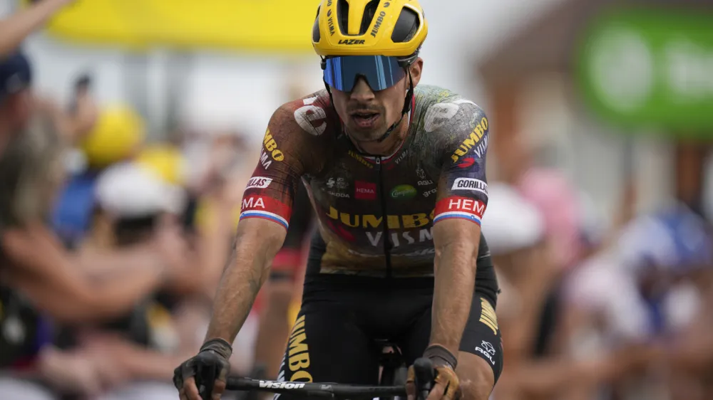 Slovenia's Primoz Roglic crosses the finish line with a delay on his main rival Slovenia's Tadej Pogacar during the fifth stage of the Tour de France cycling race over 157 kilometers (97.6 miles) with start in Lille Metropole and finish in Arenberg Porte du Hainaut, France, Wednesday, July 6, 2022. (AP Photo/Daniel Cole)