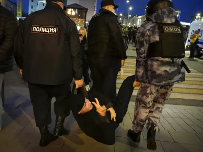 Police detain a demonstrator during a protest against mobilization in Moscow, Russia, Wednesday, Sept. 21, 2022. Russian President Vladimir Putin has ordered a partial mobilization of reservists in Russia, effective immediately. (AP Photo/Alexander Zemlianichenko)