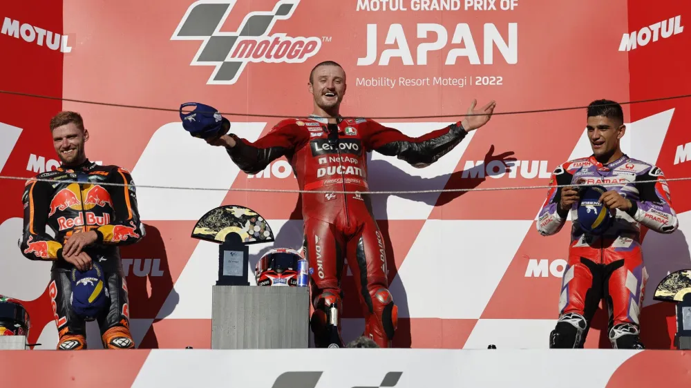 Motorcycling - MotoGP - Japanese Grand Prix - Suzuka Circuit, Suzuka, Japan - September 25, 2022 Ducati Lenovo's Jack Miller celebrates on the podium after winning the race alongside second placed Red Bull KTM Factory Racing's Brad Binder and third placed Pramac Racing's Jorge Martin REUTERS/Issei Kato