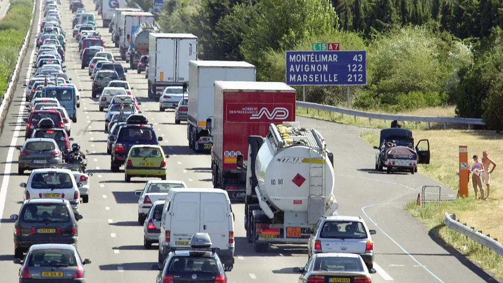 South-bound travelers jam the highway near Valence, central France, Friday, July 18, 2003. Traffic was expected to be very heavy throughout France over the week-end as more people head south for their summer vacations. (AP Photo/Patrick Gardin)