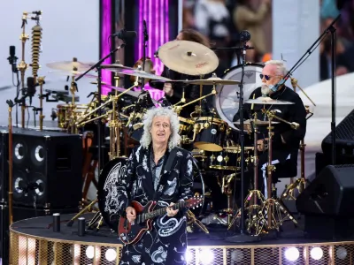 FILE PHOTO: Brian May plays the guitar as the band Queen performs at the Queen's Platinum Jubilee celebrations, in London, Britain June 4, 2022. REUTERS/Hannah McKay/Pool/File Photo