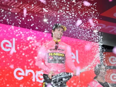 13 May 2019, Italy, Orbetello: Slovenian cyclist Primoz Roglic celebrates on stage after the end of the third stage of the 102nd edition of the Giro d'Italia cycling race, 220 km from Vinci to Orbetello. Photo: Massimo Paolone/Lapresse via ZUMA Press/dpa