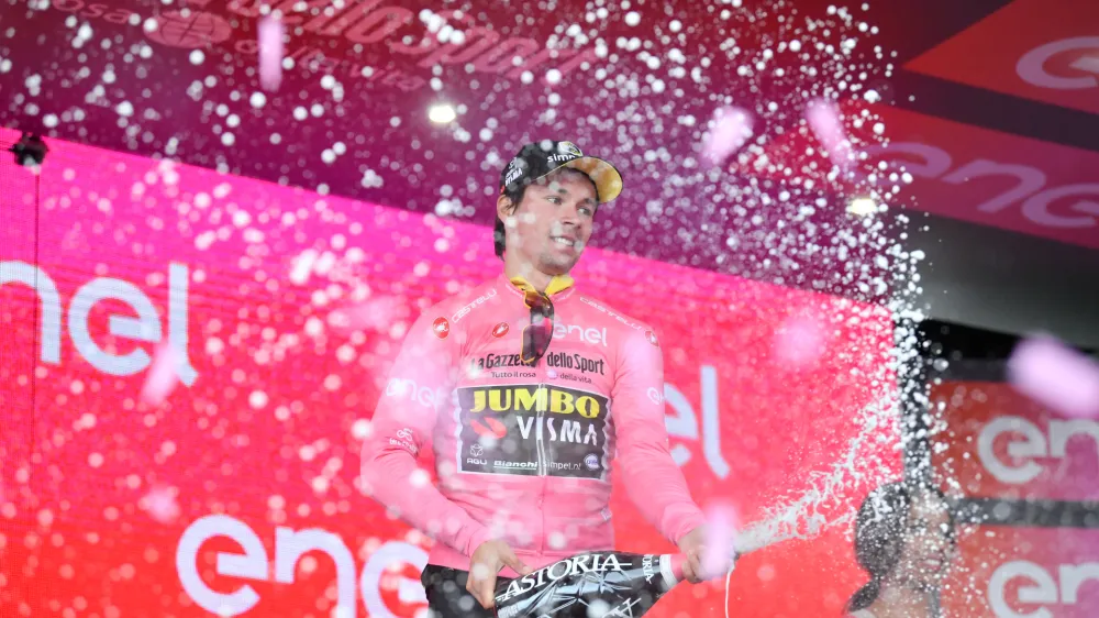13 May 2019, Italy, Orbetello: Slovenian cyclist Primoz Roglic celebrates on stage after the end of the third stage of the 102nd edition of the Giro d'Italia cycling race, 220 km from Vinci to Orbetello. Photo: Massimo Paolone/Lapresse via ZUMA Press/dpa