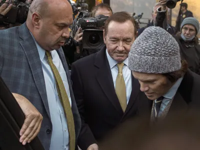 Actor Kevin Spacey, center, leaves the Daniel Patrick Moynihan Court House on Thursday, Oct. 20, 2022, in New York. A jury sided with Kevin Spacey on Thursday in one of the lawsuits that derailed the film star's career, finding he did not sexually abuse Anthony Rapp, then 14, while both were relatively unknown actors in Broadway plays in 1980s. (AP Photo/Andres Kudacki)