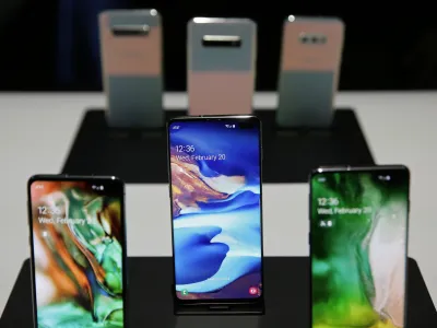 The new Samsung S10 phones are displayed in a demonstration room after an event Wednesday, Feb. 20, 2019, in San Francisco. Samsung is hailing the 10th anniversary of its first smartphone with three new models that seem unlikely to reverse a sales slump in an industry recycling the same ideas. The S10 line-up unveiled Wednesday in San Francisco all boast fancy cameras, sleek screens covering the entire front of the device and at least 128 gigabytes of storage, the most important features to consumers looking for a new smartphone. (AP Photo/Eric Risberg)