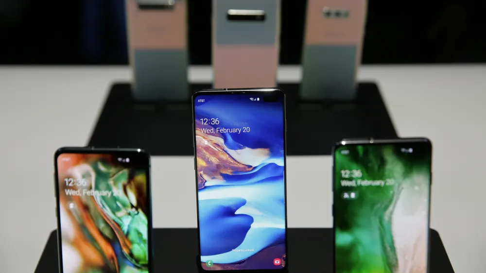 The new Samsung S10 phones are displayed in a demonstration room after an event Wednesday, Feb. 20, 2019, in San Francisco. Samsung is hailing the 10th anniversary of its first smartphone with three new models that seem unlikely to reverse a sales slump in an industry recycling the same ideas. The S10 line-up unveiled Wednesday in San Francisco all boast fancy cameras, sleek screens covering the entire front of the device and at least 128 gigabytes of storage, the most important features to consumers looking for a new smartphone. (AP Photo/Eric Risberg)