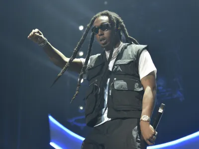 FILE - Takeoff of the group Migos performs during the 2019 BET Experience in Los Angeles on June 22, 2019. A representative confirms that rapper Takeoff is dead after a shooting outside of a Houston bowling alley. Takeoff, whose real name was Kirsnick Khari Ball, was part of Migos along with Quavo and Offset. He was 28. (Photo by Richard Shotwell/Invision/AP, File)