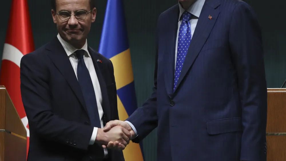 Turkish President Recep Tayyip Erdogan, right, and Sweden's new prime minister, Ulf Kristersson, shake hands after a joint press conference at the presidential palace in Ankara, Turkey, Tuesday, Nov. 8, 2022. Kristersson met Erdogan on Tuesday in an effort to clinch Turkish approval for his country's bid to join NATO.(AP Photo/Burhan Ozbilici)