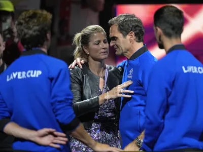 An emotional Roger Federer of Team Europe is embraced by his wife Mirka after playing with Rafael Nadal in a Laver Cup doubles match against Team World's Jack Sock and Frances Tiafoe at the O2 arena in London, Friday, Sept. 23, 2022. Federer's losing doubles match with Nadal marked the end of an illustrious career that included 20 Grand Slam titles and a role as a statesman for tennis. (AP Photo/Kin Cheung)