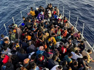 Migrants are seen on a boat after being rescued by the Libyan coast Guard in Tripoli, Libya. November 10, 2022. REUTERS/Stringer NO RESALES. NO ARCHIVES