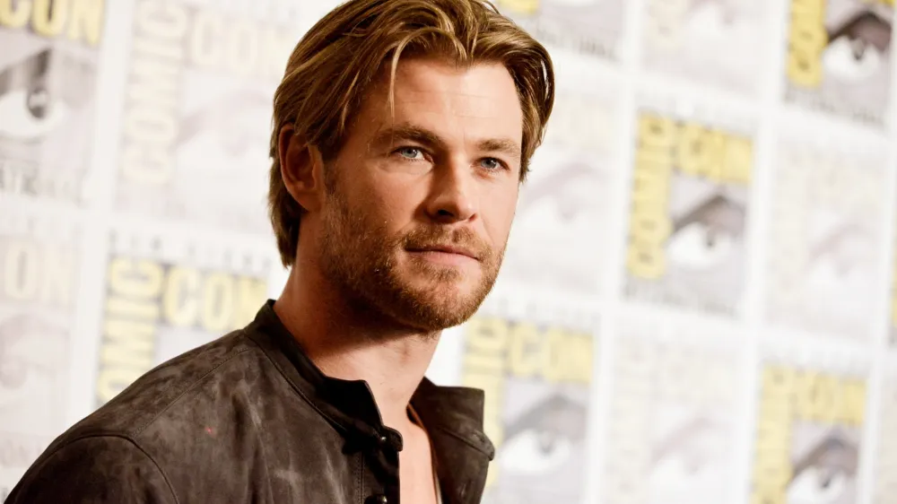 FILE - In this July 26, 2014 file photo, Chris Hemsworth attends the Marvel press line at Comic-Con International in San Diego. People magazine has named Chris Hemsworth the "Sexiest Man Alive" of 2014, cheering the Australian actor's rise as hammer-wielding, bone fide hunk in the "Thor" films. (Photo by Richard Shotwell/Invision/AP, File)