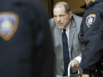 Harvey Weinstein, center, is escorted by court officers as he leaves court for the day during jury selection in his trial on rape and sexual assault charges, Wednesday, Jan. 15, 2020, in New York. Jury selection continues Thursday. (AP Photo/Mary Altaffer)