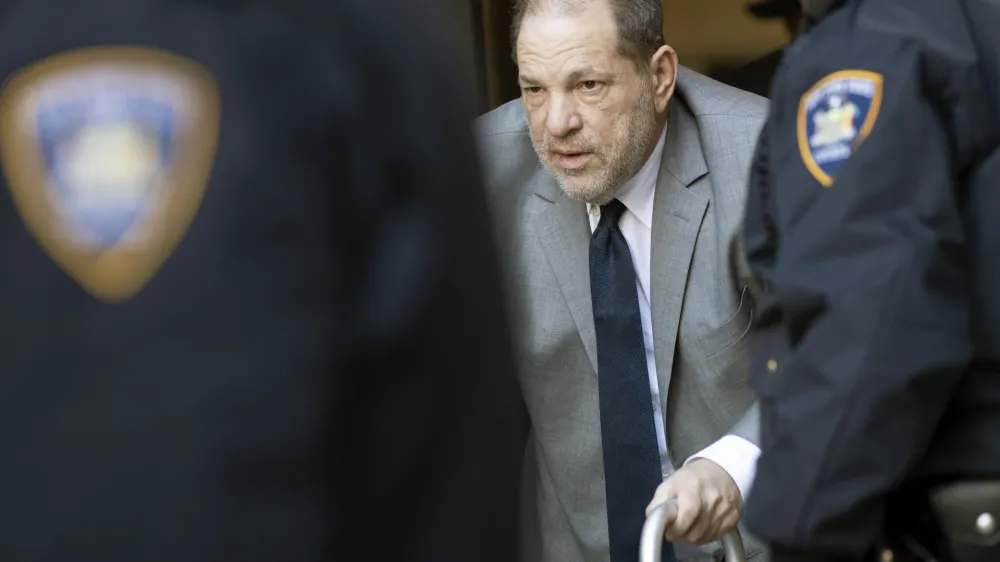 Harvey Weinstein, center, is escorted by court officers as he leaves court for the day during jury selection in his trial on rape and sexual assault charges, Wednesday, Jan. 15, 2020, in New York. Jury selection continues Thursday. (AP Photo/Mary Altaffer)