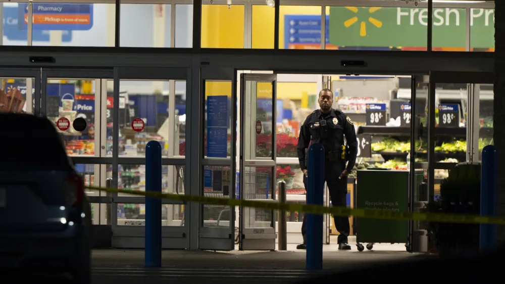 Law enforcement work at the scene of a mass shooting at a Walmart, Wednesday, Nov. 23, 2022, in Chesapeake, Va. (AP Photo/Alex Brandon)