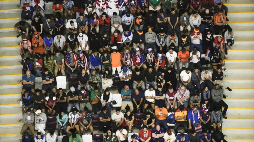 FILE - Soccer fans follow the game during the World Cup round of 16 soccer match between the Netherlands and the United States, at the Khalifa International Stadium in Doha, Qatar, Saturday, Dec. 3, 2022. (AP Photo/Hassan Ammar, File)