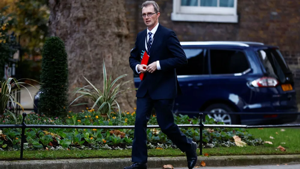 British Secretary of State for Wales David TC Davies walks outside Downing Street in London, Britain December 6, 2022. REUTERS/Peter Nicholls
