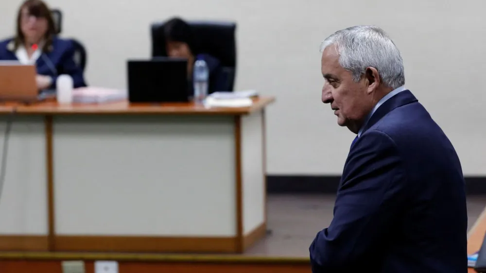 Former Guatemalan President Otto Perez Molina walks in front of the judges after being found guilty of a corruption case during his administration, at the judicial building, in Guatemala City, Guatemala December 7, 2022. REUTERS/Luis Echeverria