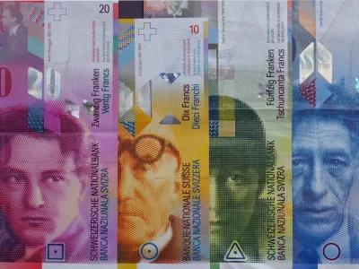 ILLUSTRATION - Banknotes of the Swiss franc currency sit on a table in Wengen, Switzerland, 04 August 2013. (R-L) 100 franc Alberto Giacometti, 50 franc Sophie Taeuber-Arp, 10 franc Le Corbusier, 20 francs Arthur Honeggerr. Photo by: Soeren Stache/picture-alliance/dpa/AP Images