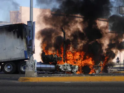 A truck burns on a street in Culiacan, Sinaloa state, Thursday Jan. 5, 2023. Mexican security forces captured Ovidio Guzm&aacute;n, an alleged drug trafficker wanted by the United States and one of the sons of former Sinaloa cartel boss Joaqu&iacute;n "El Chapo" Guzm&aacute;n, in a pre-dawn operation Thursday that set off gunfights and roadblocks across the western state's capital. (AP Photo/Martin Urista)