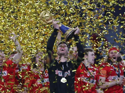Handball - 2021 IHF Handball World Championship - Gold Medal Match - Denmark v Sweden - Cairo Stadium Hall 1, Cairo, Egypt - January 31, 2021 Denmark's Niklas Landin Jacobsen lifts the trophy as they celebrate after winning the Gold Medal Match REUTERS/Mohamed Abd El Ghany