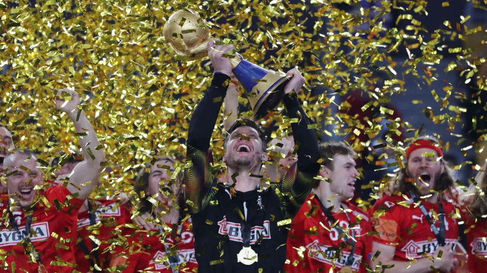 Handball - 2021 IHF Handball World Championship - Gold Medal Match - Denmark v Sweden - Cairo Stadium Hall 1, Cairo, Egypt - January 31, 2021 Denmark's Niklas Landin Jacobsen lifts the trophy as they celebrate after winning the Gold Medal Match REUTERS/Mohamed Abd El Ghany