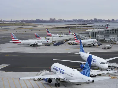 Planes sit on the tarmac at Terminal B at LaGuardia Airport in New York, Wednesday, Jan. 11, 2023. The Federal Aviation Administration is lifting a ground stop on flights across the U.S. following a computer outage early Wednesday that resulted in thousands of delays and hundreds of cancellations quickly cascading through the system at airports nationwide. (AP Photo/Seth Wenig)