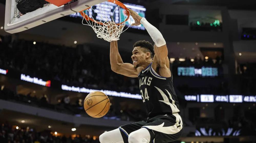 Milwaukee Bucks forward Giannis Antetokounmpo (34) dunks against the Boston Celtics during an NBA basketball game, Tuesday, Feb. 14, 2023, in Milwaukee. (AP Photo/Jeffrey Phelps)