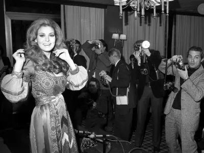 FILE - American actress Raquel Welch poses for photographers in Paris on Jan. 15, 1970. Welch, whose emergence from the sea in a skimpy, furry bikini in the film "One Million Years B.C." would propel her to international sex symbol status throughout the 1960s and '70s, died early Wednesday, Feb. 15, 2023, after a brief illness. She was 82. (AP Photo/Michel Lipchitz, File)