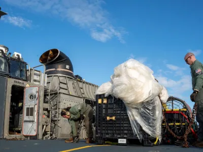 U.S. Navy sailors assigned to Assault Craft Unit 4 prepare material recovered in the Atlantic Ocean from a high-altitude Chinese balloon shot down by the U.S. Air Force off the coast of South Carolina for transport from a ship docked at Virginia Beach, Virginia to federal agents at Joint Expeditionary Base Little Creek on February 10, 2023 in this image released by the U.S. Navy in Washington, U.S. February 13, 2023. Petty Officer 1st Class Kris Lindstrom/U.S. Navy/Handout via Reuters THIS IMAGE HAS BEEN SUPPLIED BY A THIRD PARTY.