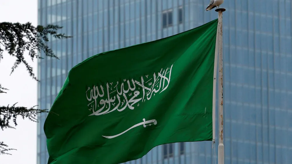 FILE PHOTO: A Saudi flag flutters atop Saudi Arabia's consulate in Istanbul, Turkey October 20, 2018. REUTERS/Huseyin Aldemir/File Photo