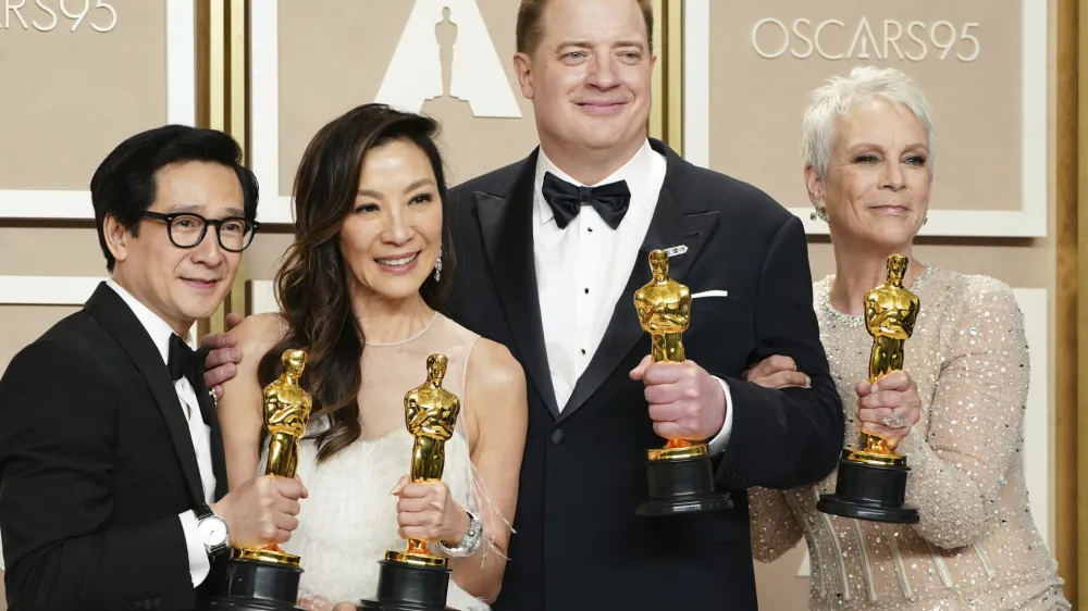 Ke Huy Quan, from left, Michelle Yeoh, Brendan Fraser and Jamie Lee Curtis pose with their awards in the press room at the Oscars on Sunday, March 12, 2023, at the Dolby Theatre in Los Angeles. Brendan Fraser, third from left, won best performance by an actor in a leading role for "The Whale." Ke Huy Quan, from left, Michelle Yeoh and Jamie Lee Curtis all won for their leading and supporting roles in "Everything Everywhere All at Once." (Photo by Jordan Strauss/Invision/AP)